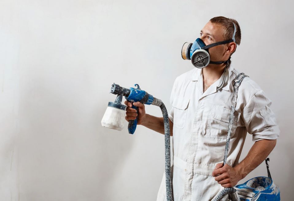 painter with painting gear working Indianapolis